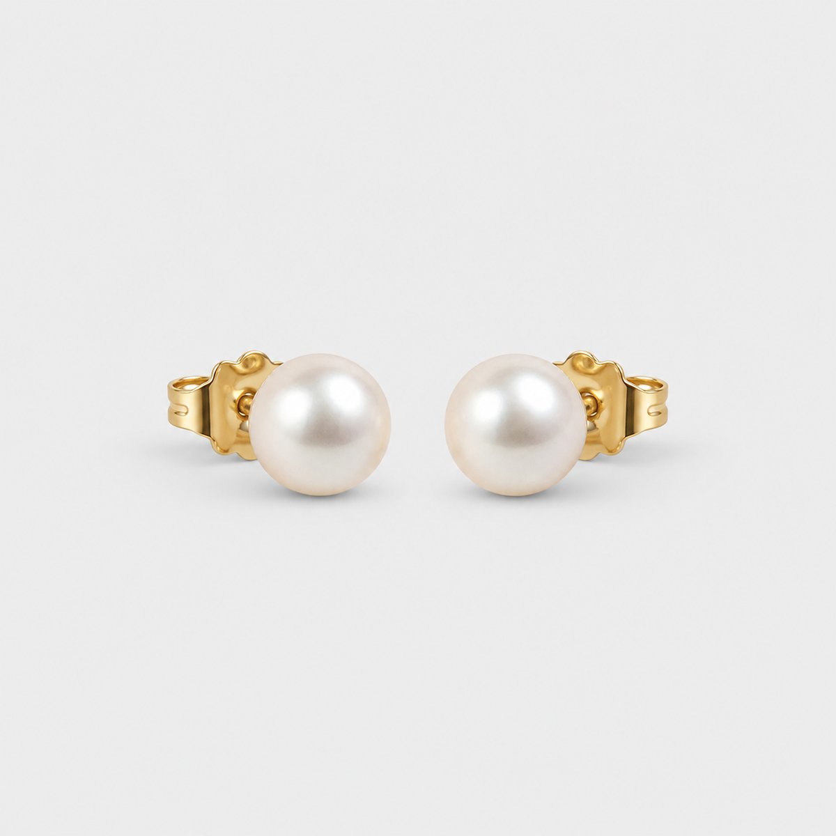 Minimal Pearl Stud Earrings left and right pair on light gray background