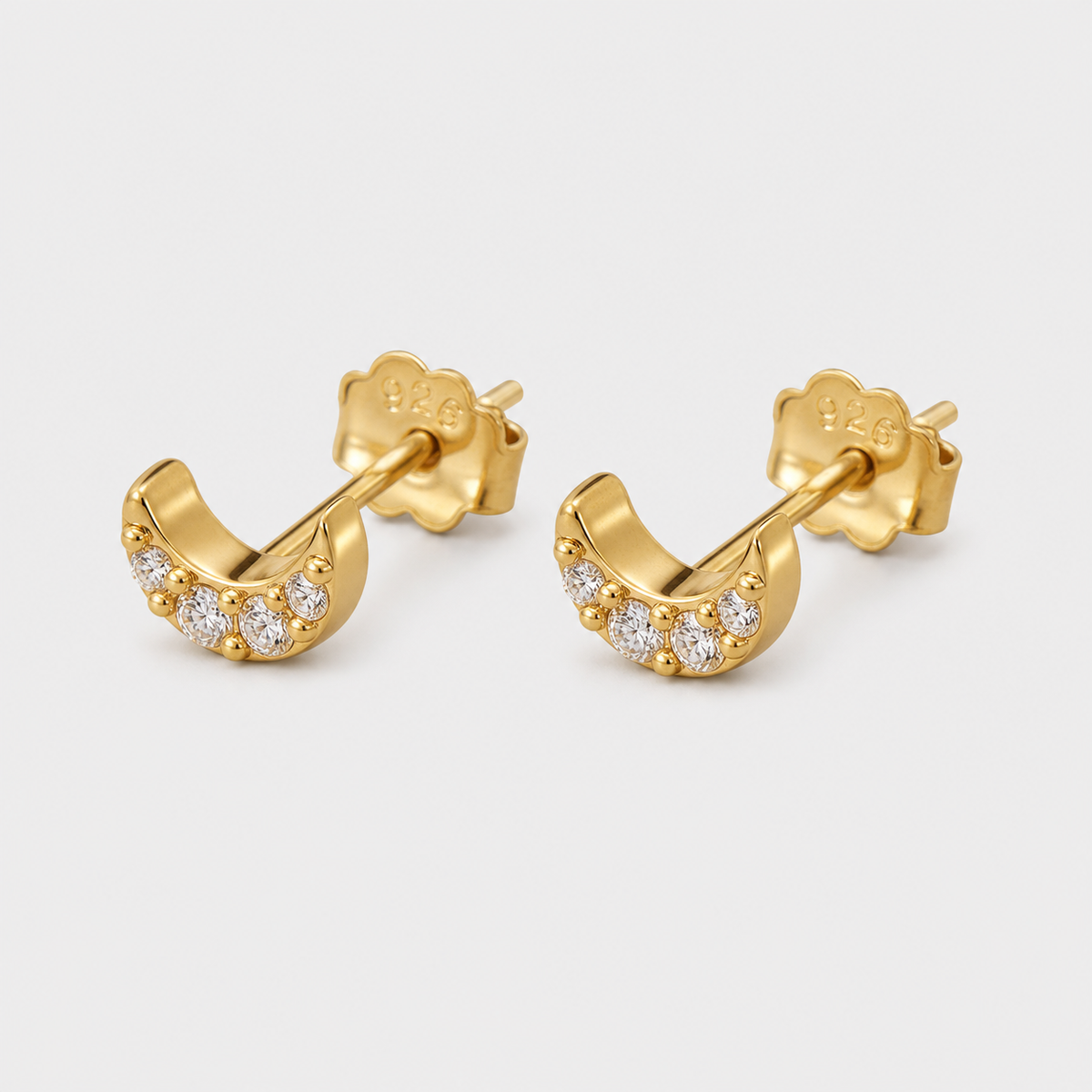 Micro Moon Crystal Stud Earrings left and right pair on light gray background