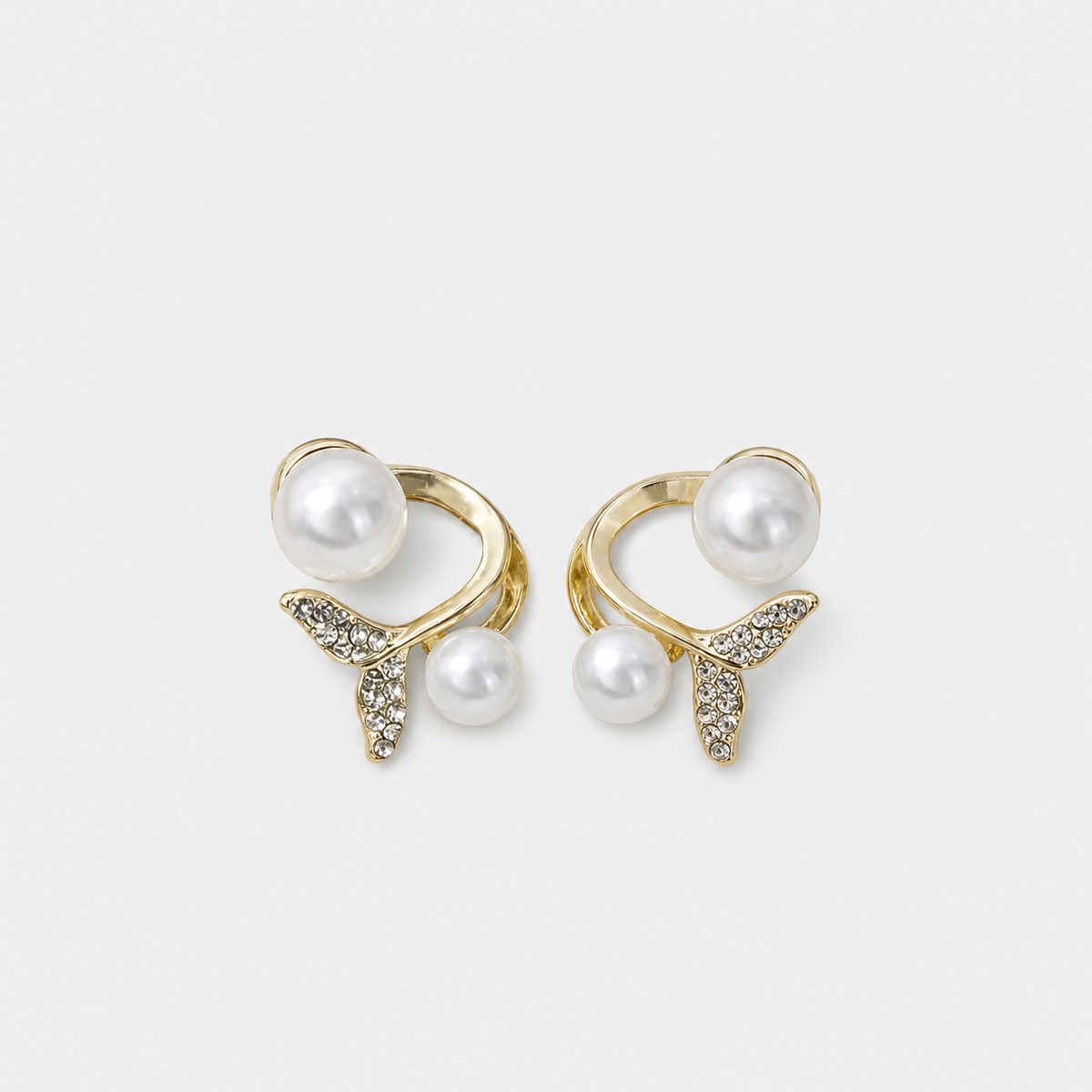Pearl Whale Tail Ear Cuff left and right pair on light gray background