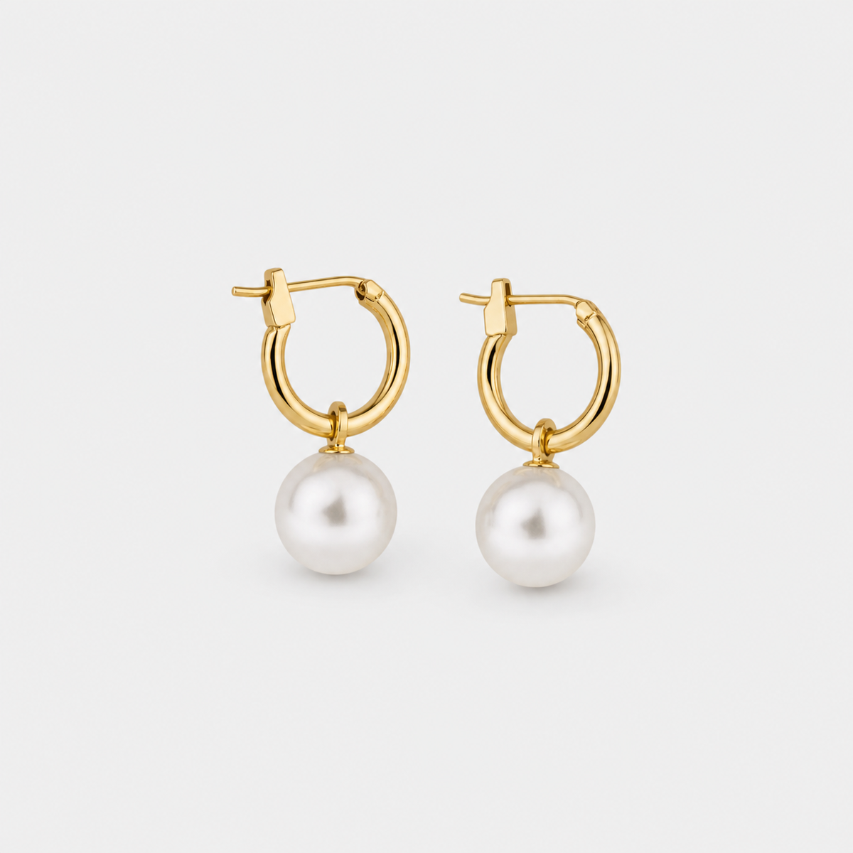 Elegant Earrings with Gold White Pearls left and right pair on light gray background