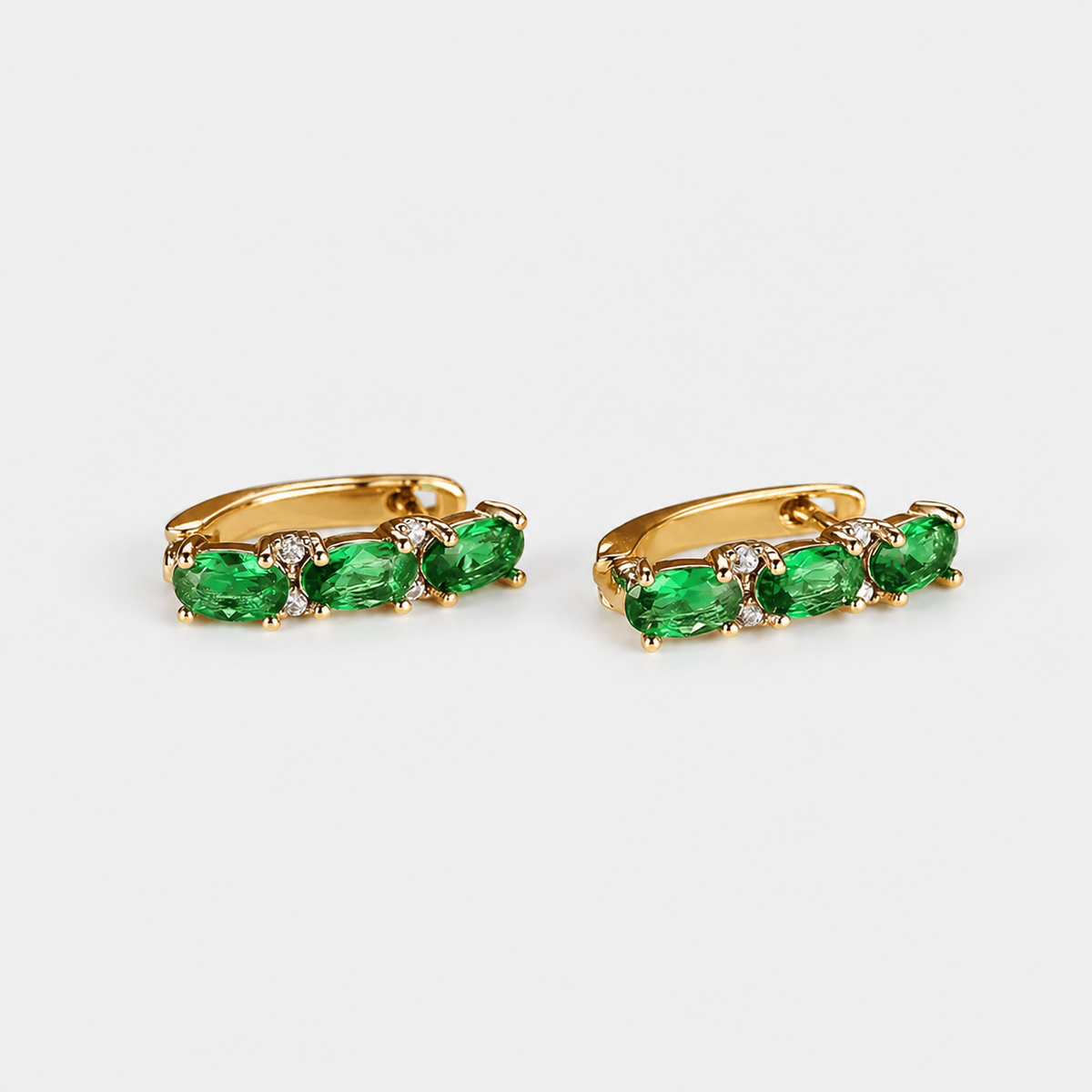 Verdant Emerald Trio Earrings left and right pair on light gray background