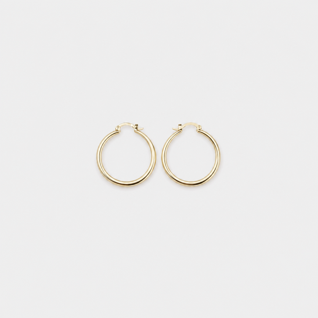 Bold Gold Hoop Earrings left and right pair on light gray background
