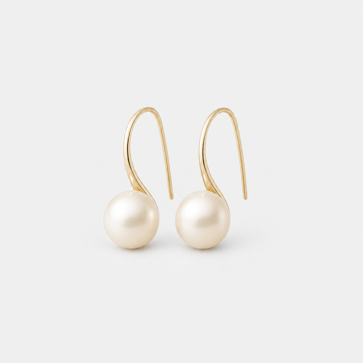 Elegant Drop Earrings with Pearls left and right pair on light gray background