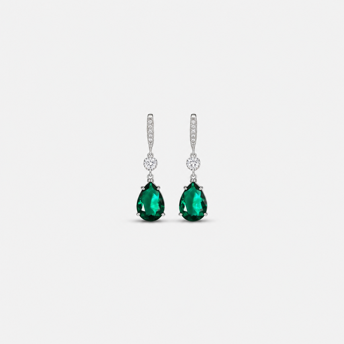 Elegant Emerald Teardrop Earrings — left and right pair on light gray background