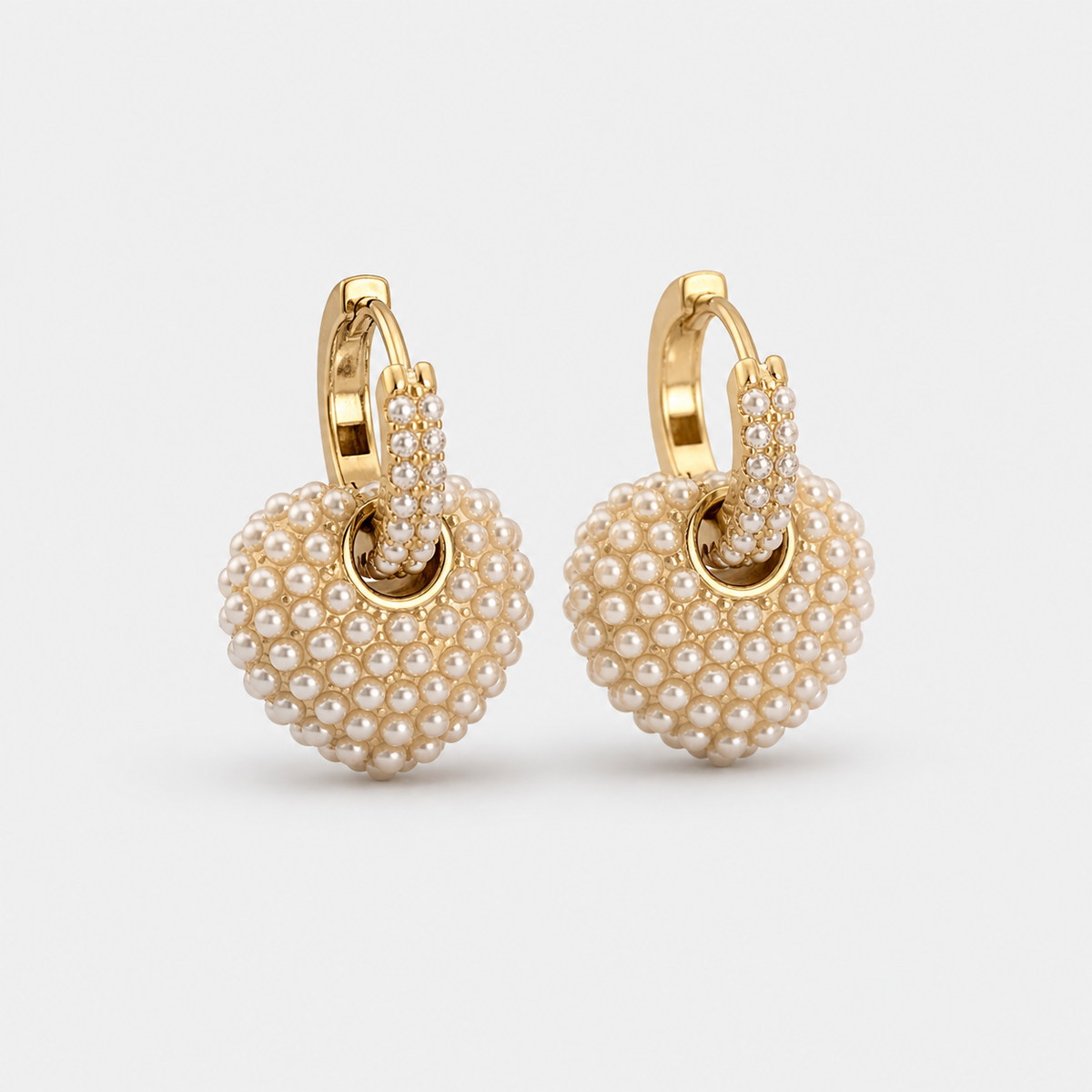 Pearl of Love Gold Earrings — left and right pair on light gray background