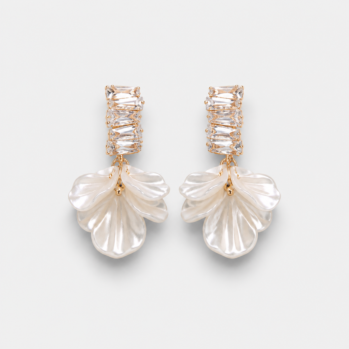 Elegant Gold Petal Earrings — left and right pair on light gray background