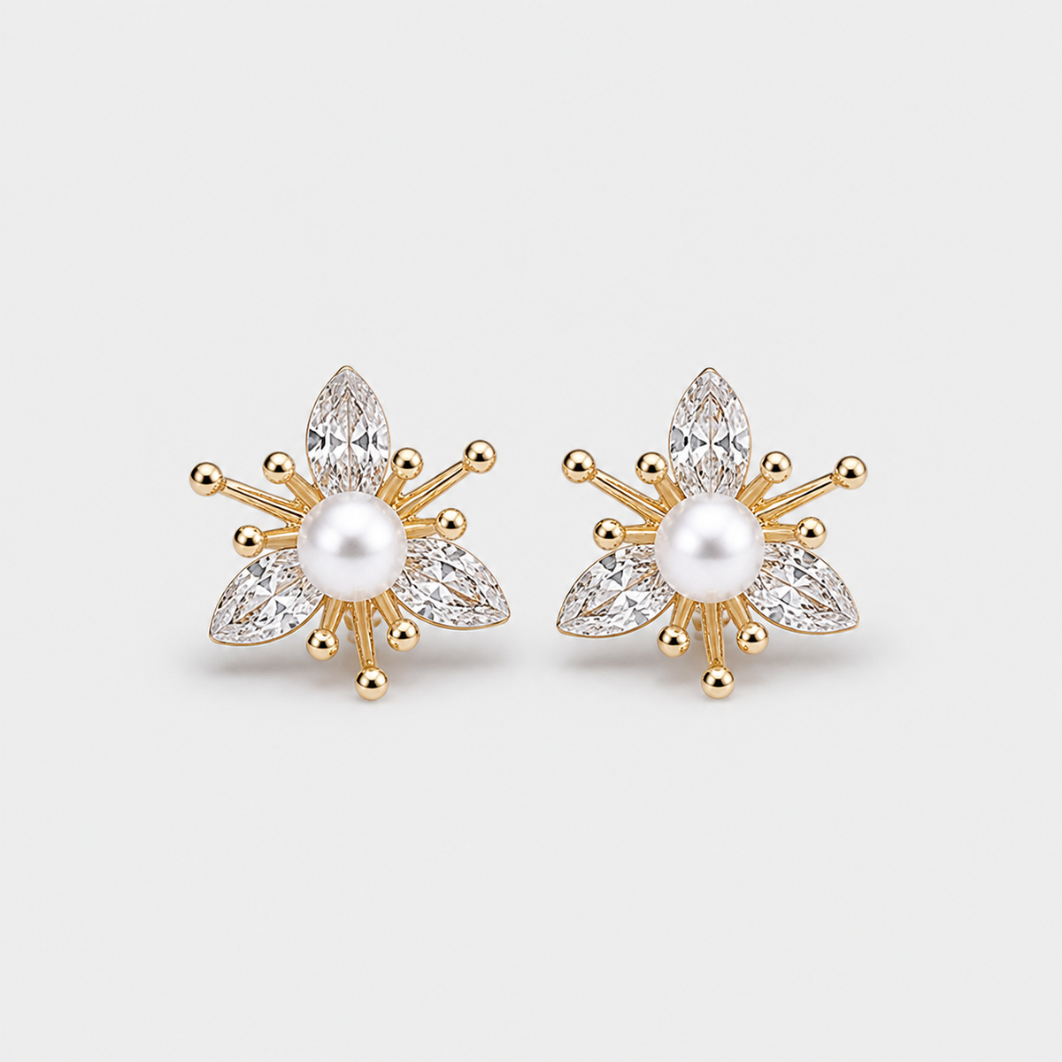 Pearl and Crystal Floral Earrings — left and right pair on light gray background