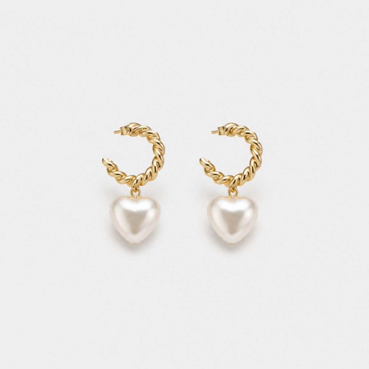 Elegant Pearl Heart Earrings — left and right pair on light gray background