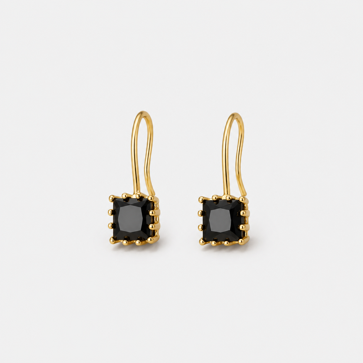 Crystal Black Stone Drop Earrings — left and right pair on light gray background