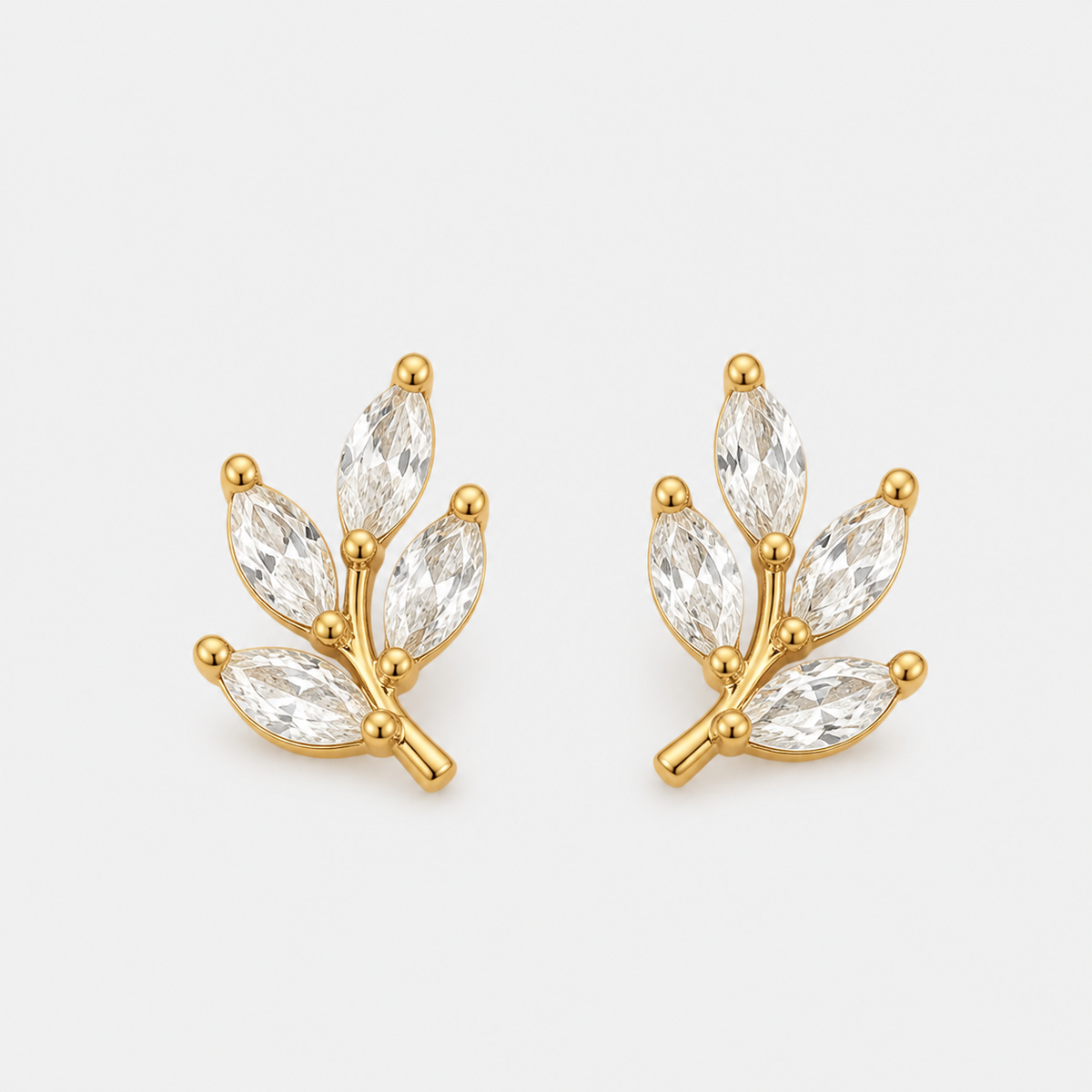 Crystal Chic Leaf Earrings — left and right pair on light gray background