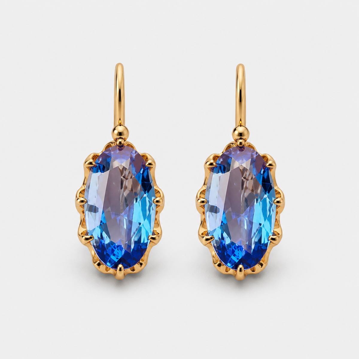 Golden Blue Bloom Earrings — left and right pair on light gray background