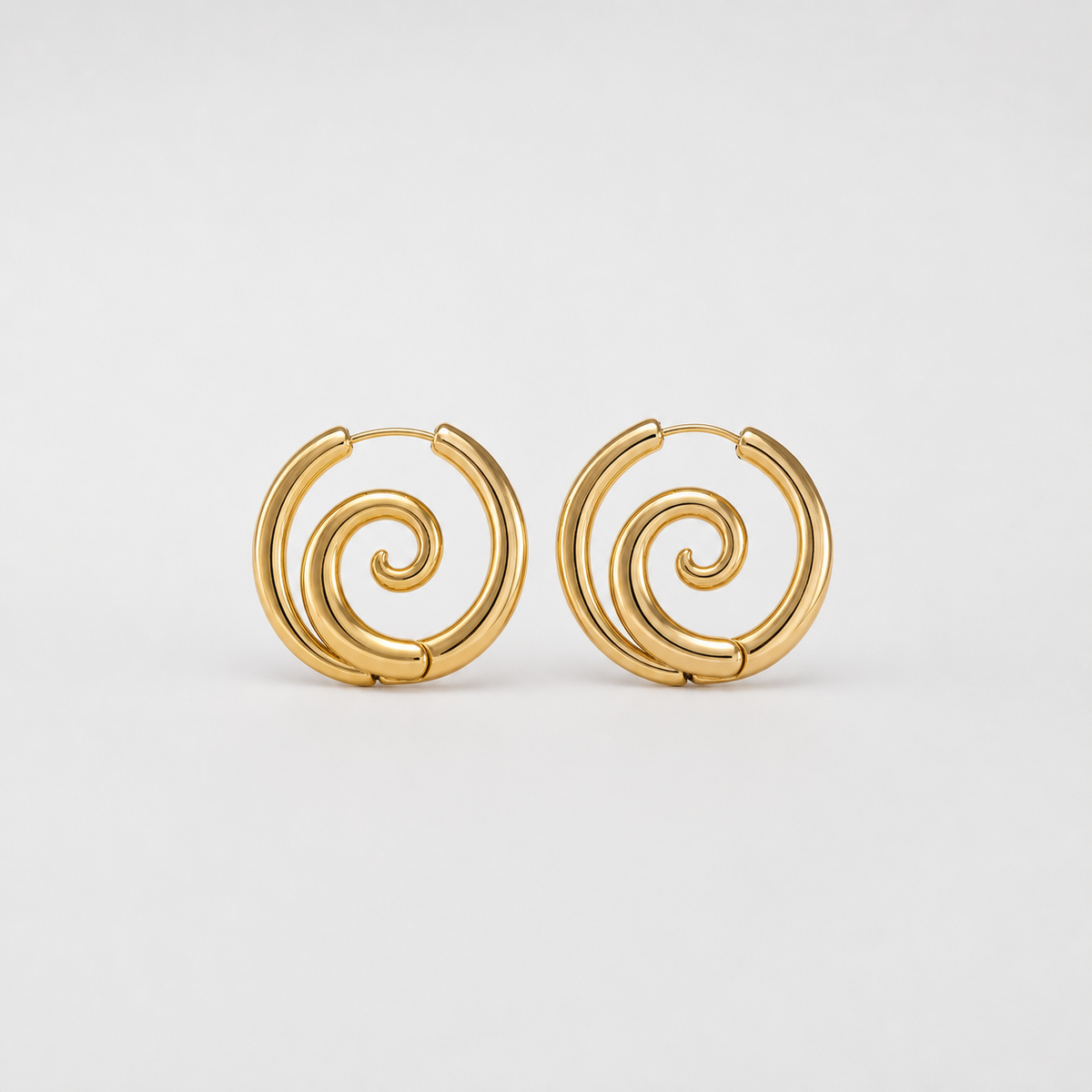Timeless Gold Spiral Earrings pair on light gray background