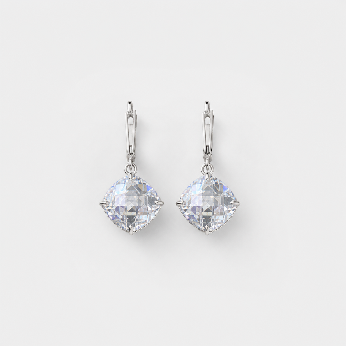White Gold Zirconia Drop Earrings pair on light gray background