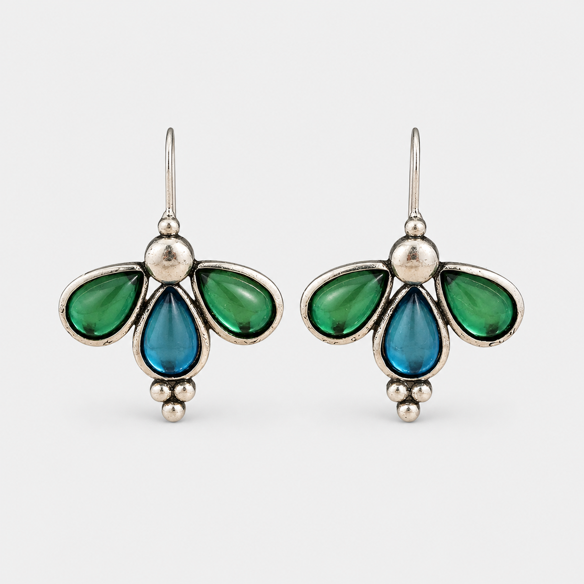 Emerald Wing Blue Teardrop Earrings – pair on light gray background