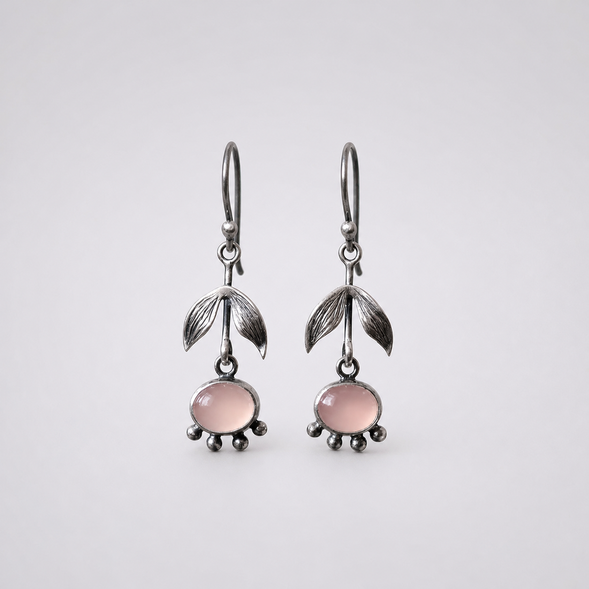 Silver Leafy Rose Quartz Drop Earrings left and right pair on light gray background