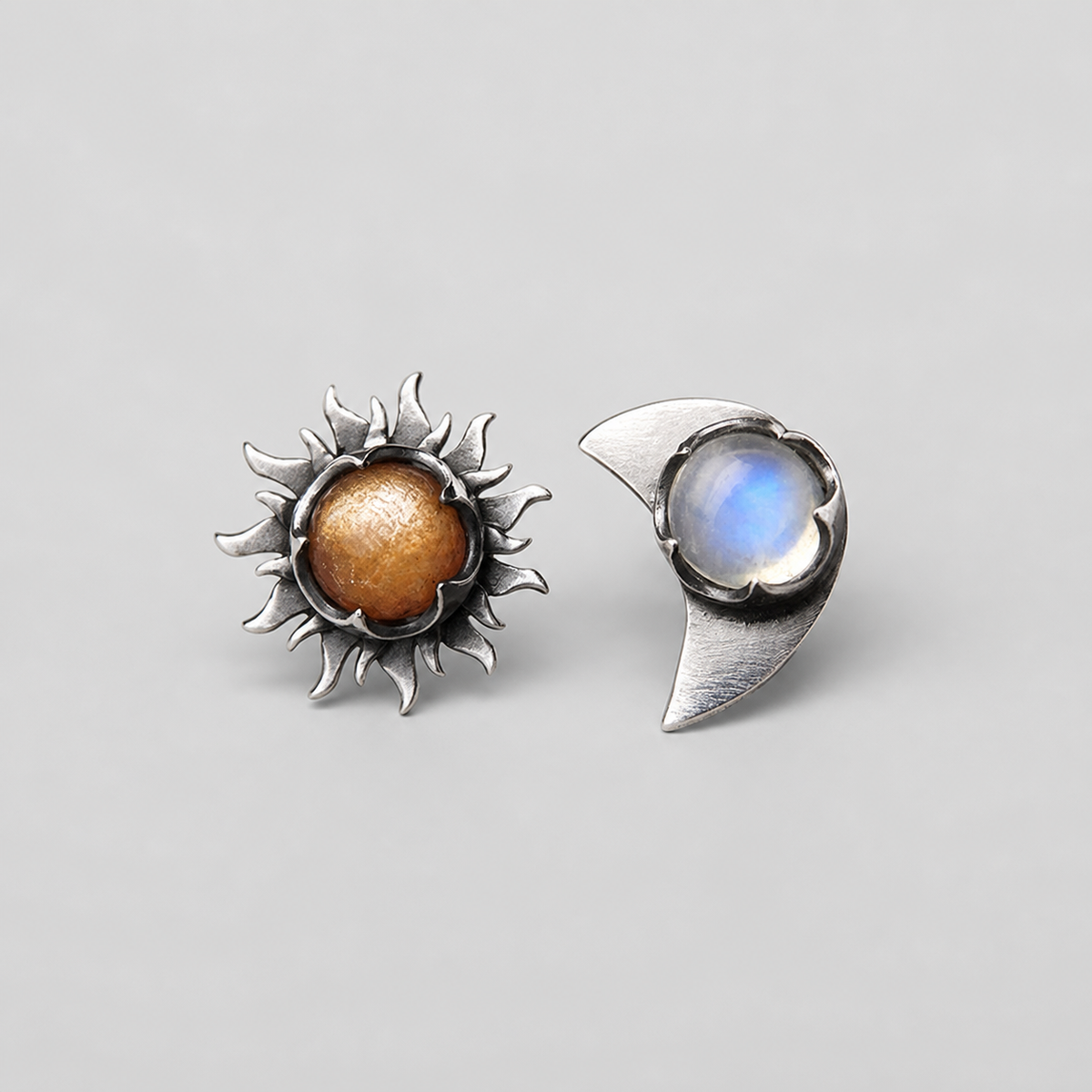 Elegant Sun Moon Earrings left and right pair on light gray background