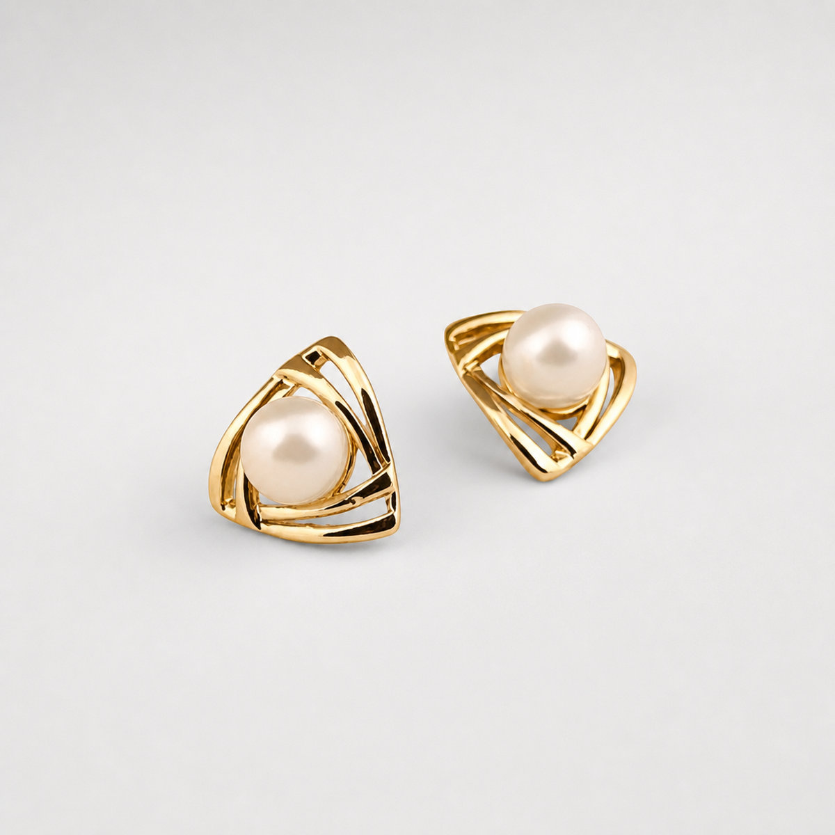 Exquisite Pearl and Gold Earrings left and right pair on light gray background