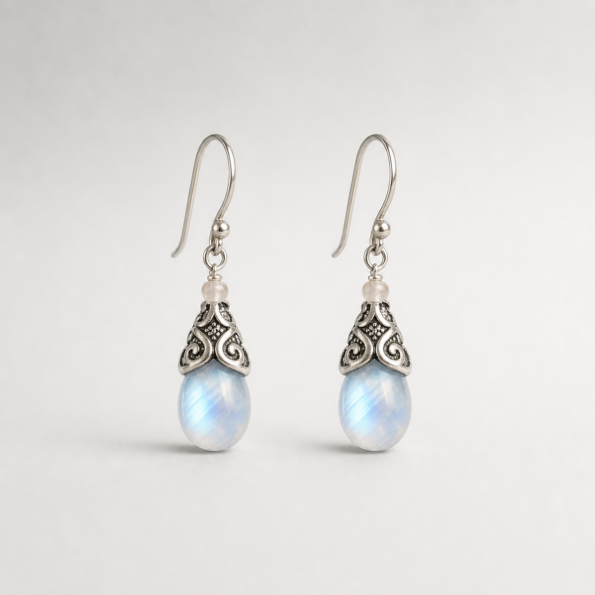 Antique Moonstone Drop Earrings left and right pair on light gray background