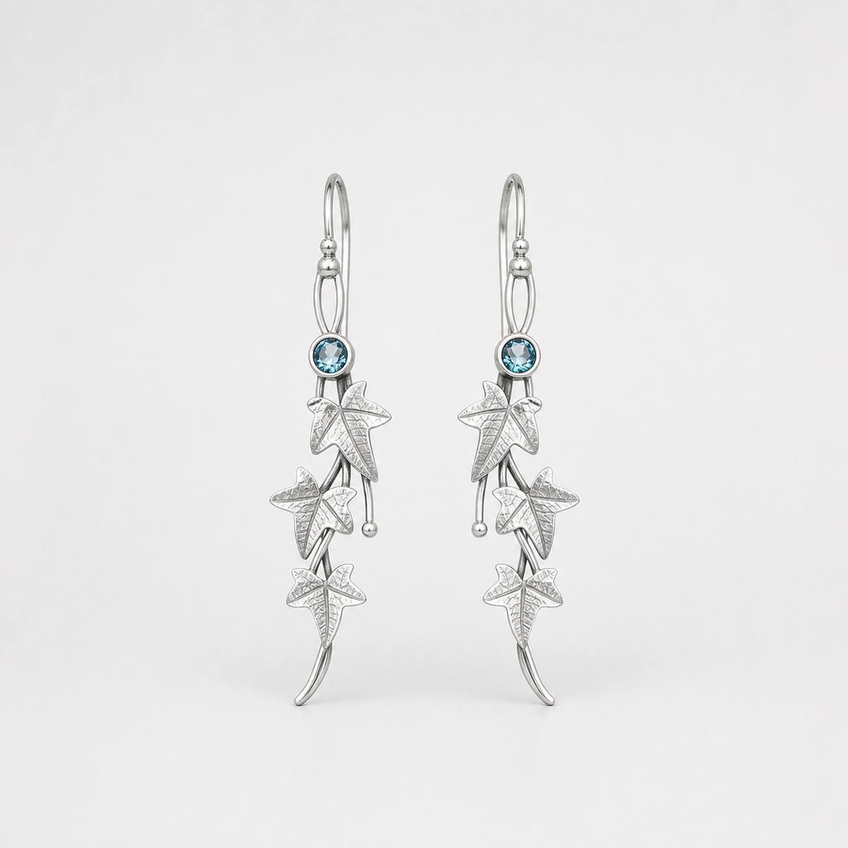 Antique Leaf Elf Earrings left and right pair on light gray background