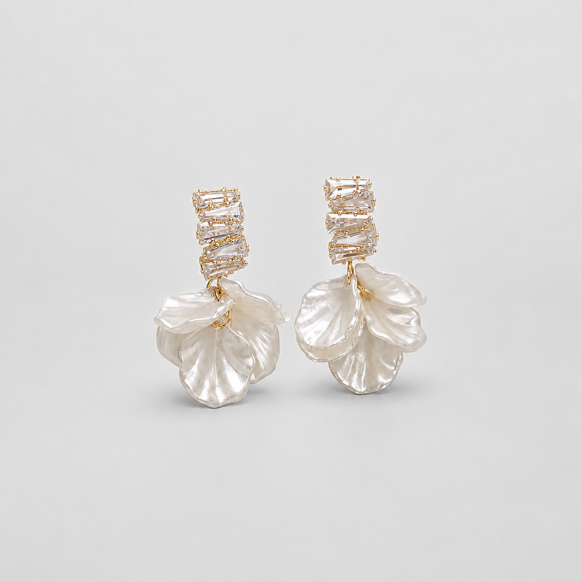 Exquisite Gold Petal Earrings in White left and right pair on light gray background