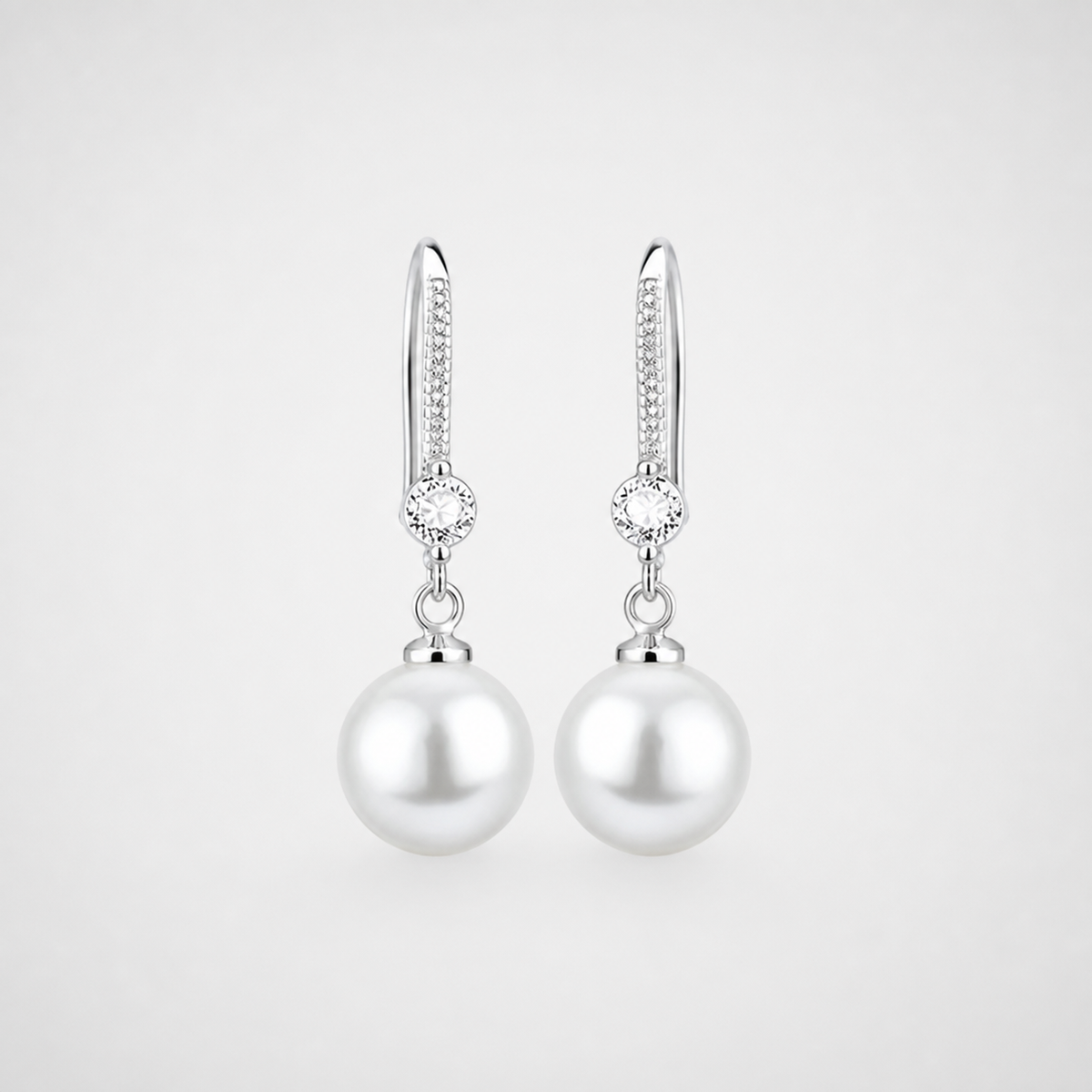 Lustrous Zirconia Pearl Drop Earrings left and right pair on light gray background