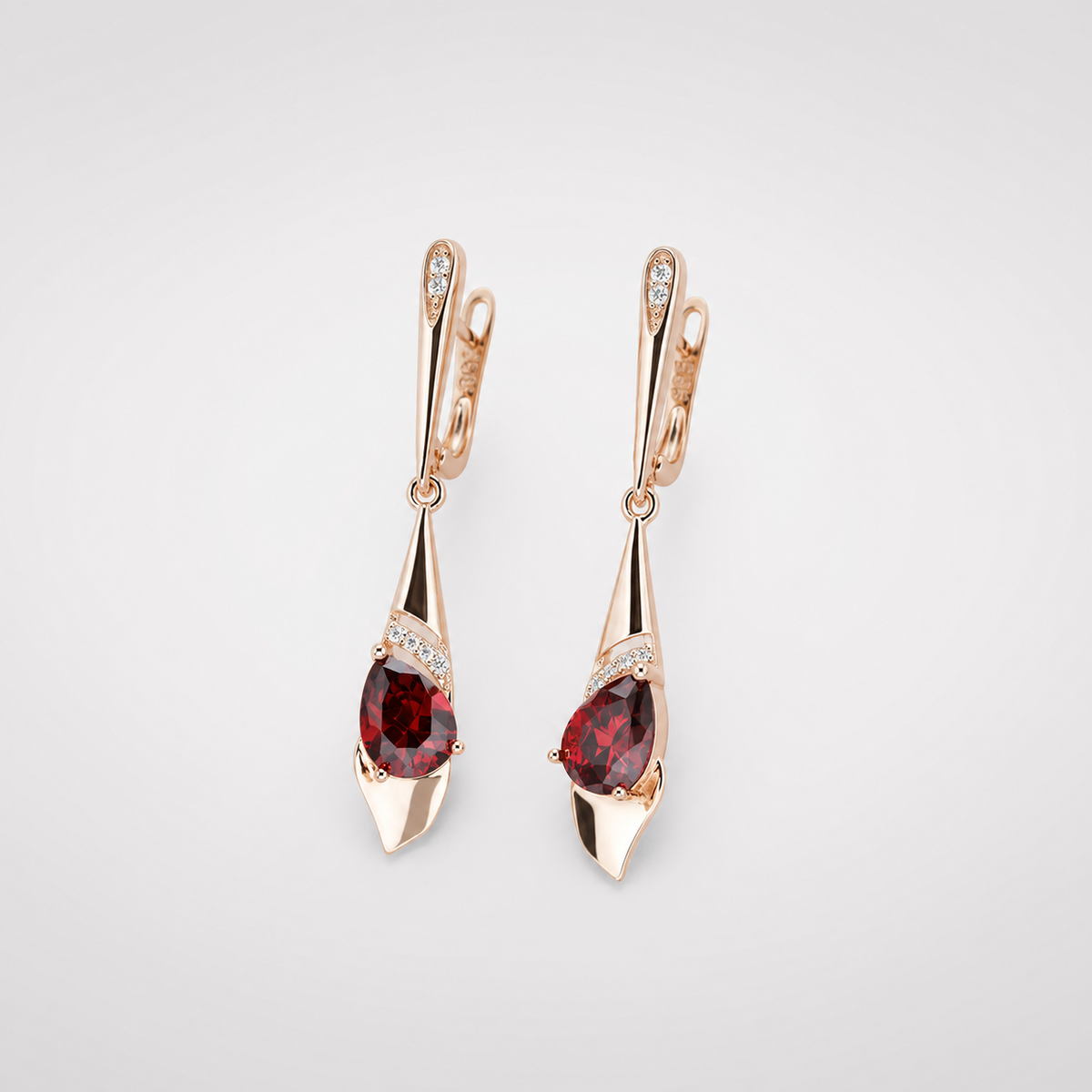 Exquisite Pendant with Red Crystal Earrings left and right pair on light gray background