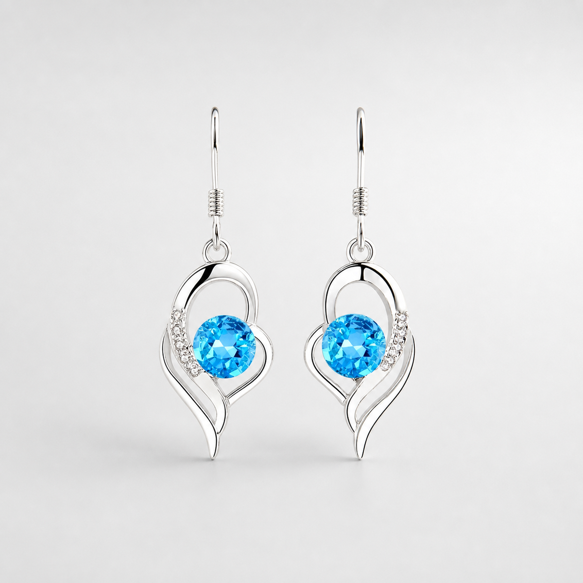 Eclipse Heart Drop Earrings left and right pair on light gray background