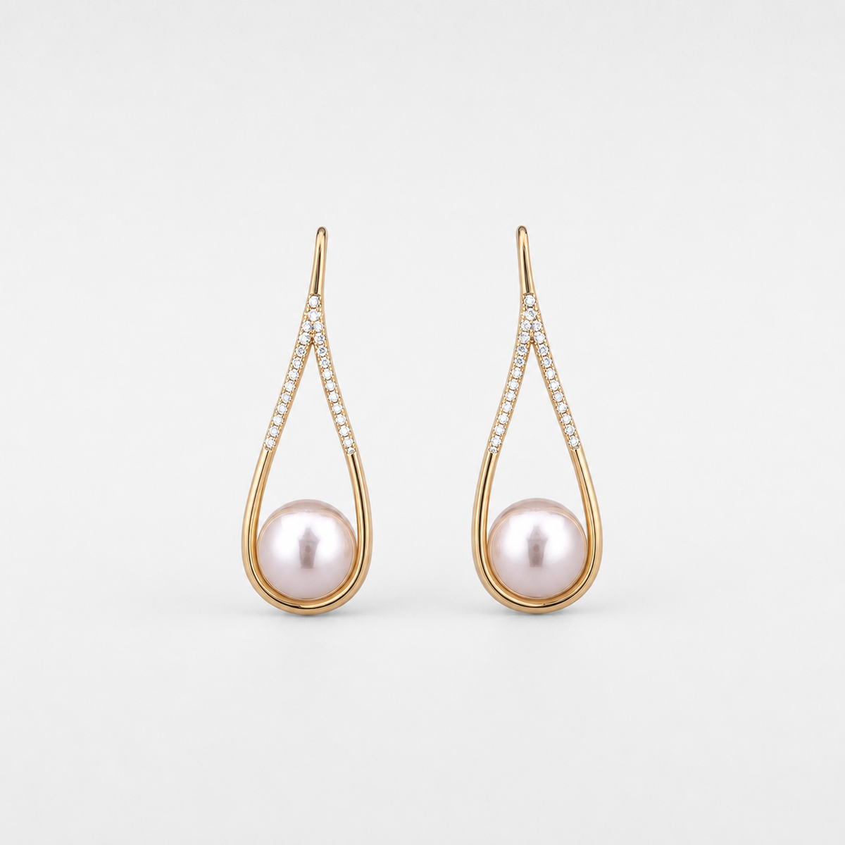 Pearl Drop Earrings left and right pair on light gray background