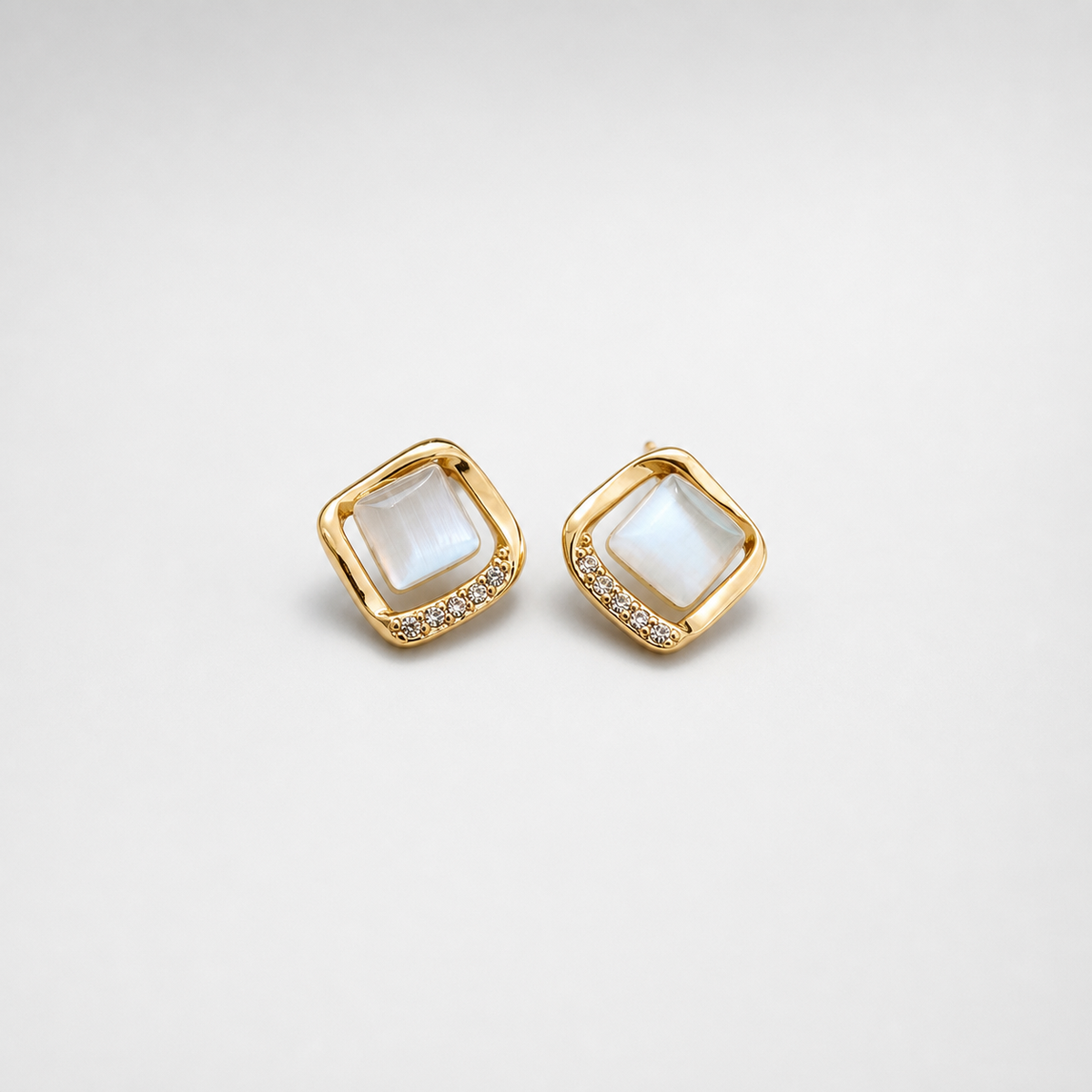 Elegant Earrings With Gold Moon Crystal left and right pair on light gray background