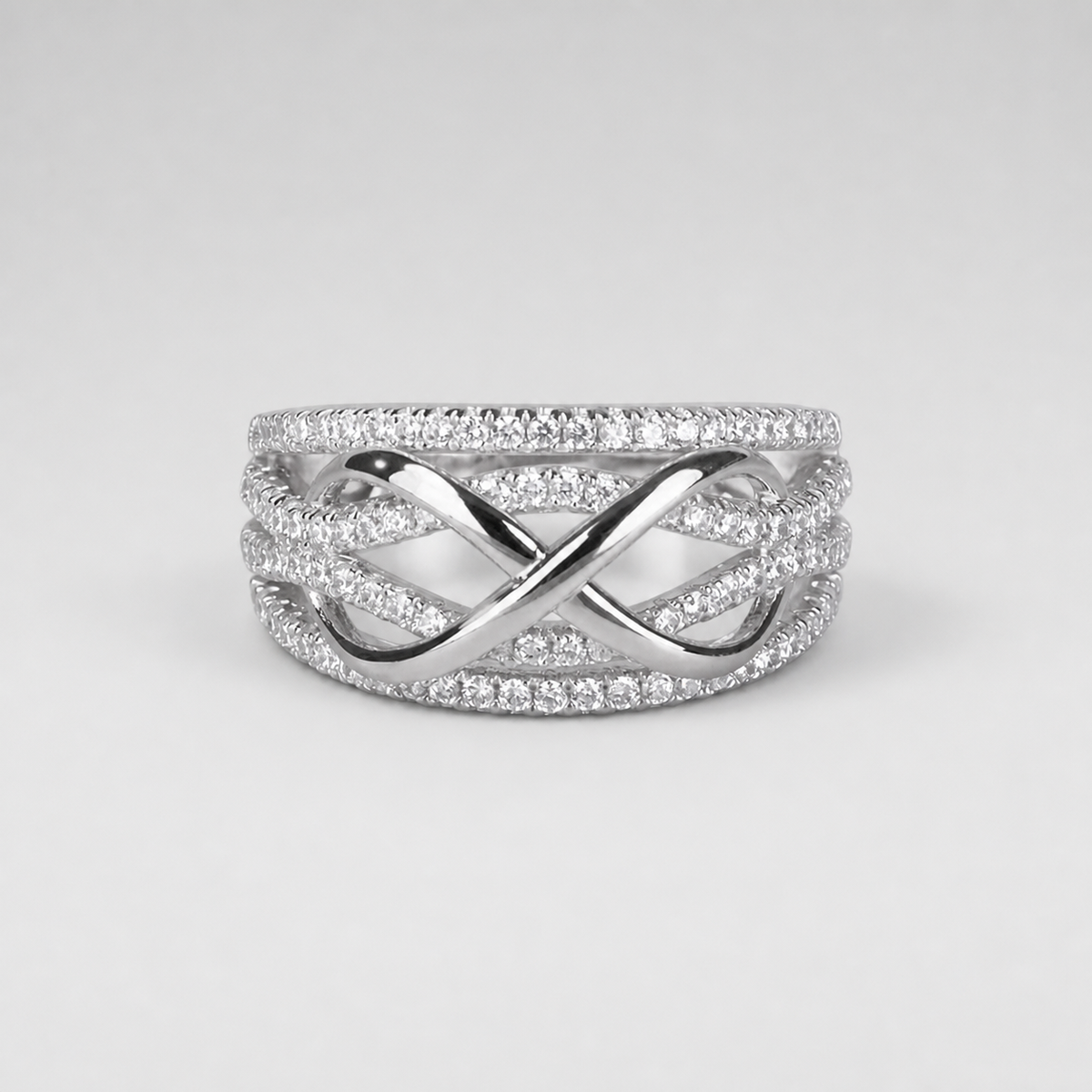 Infinity Pavé Crossover Statement Ring – centered light gray studio product photo