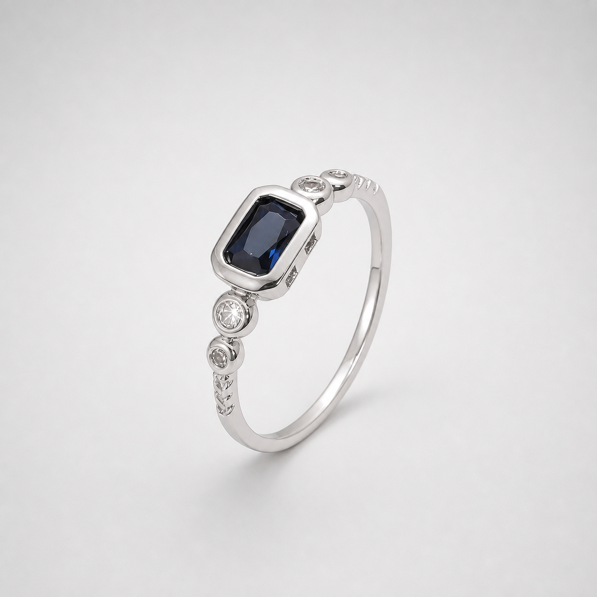 Windsor White Gold Sapphire Ring on light gray studio background