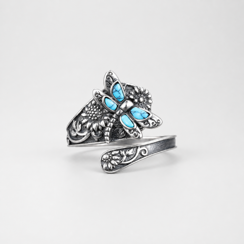 Adjustable Silver Turquoise Dragonfly Ring on light gray background