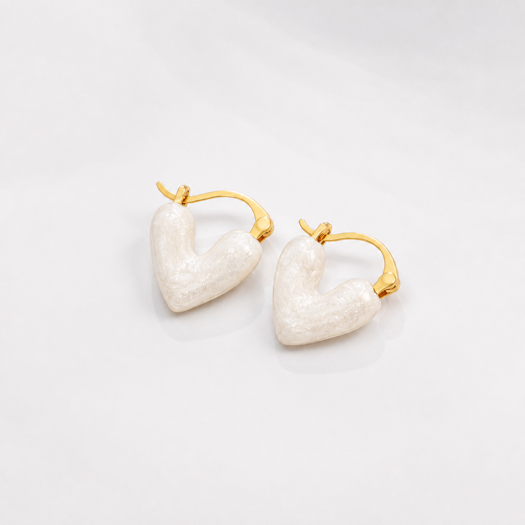 Pure White Heart Earrings on white studio background