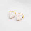 Pure White Heart Earrings on white studio background