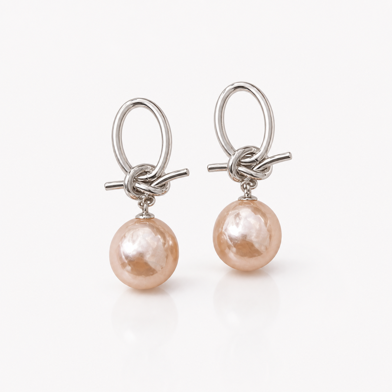 Timeless Pearl Drop Earrings on white studio background