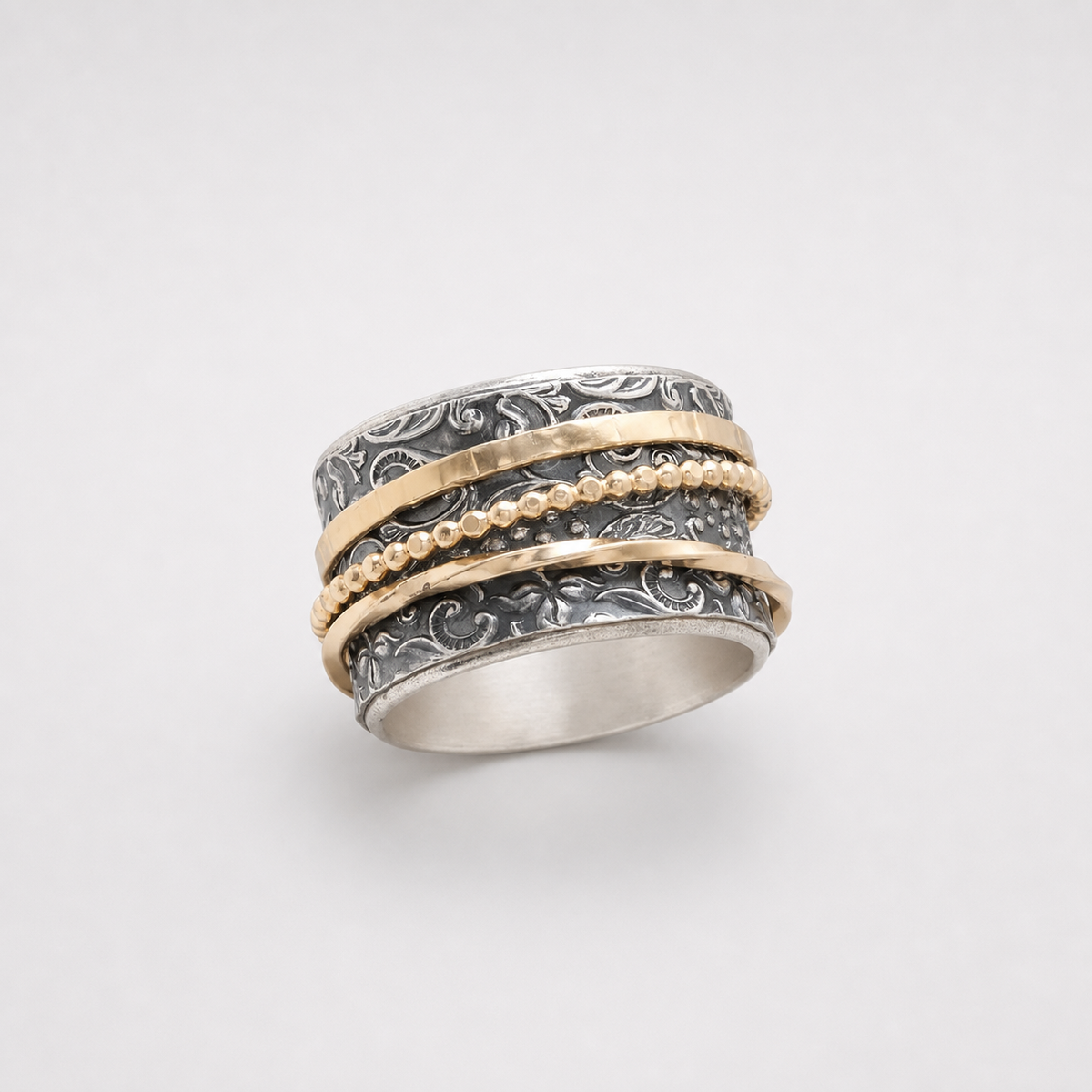Vintage Gold & Silver Antique Ring on light gray studio background